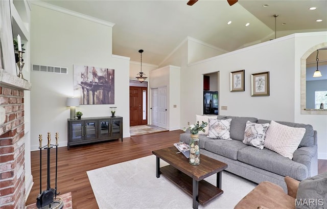 5 Tucker Manor Ct, Wentzville, MO 63385 - living area featuring a ceiling fan, a fireplace, wood finished floors, ornamental molding, and recessed lighting