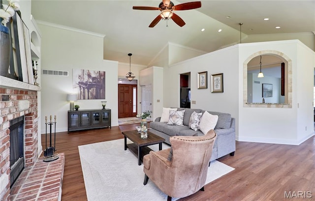 5 Tucker Manor Ct, Wentzville, MO 63385 - living room featuring ceiling fan, wood finished floors, ornamental molding, a fireplace, and recessed lighting