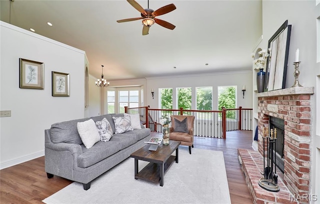 5 Tucker Manor Ct, Wentzville, MO 63385 - living area featuring ornamental molding, healthy amount of natural light, ceiling fan, and wood finished floors