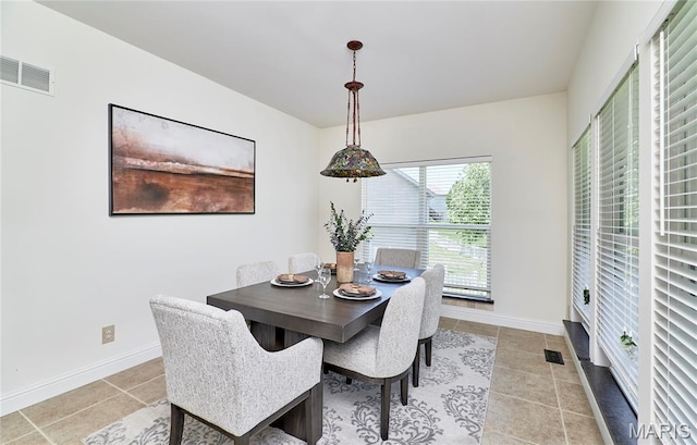 5 Tucker Manor Ct, Wentzville, MO 63385 - dining space featuring light tile patterned floors and baseboards