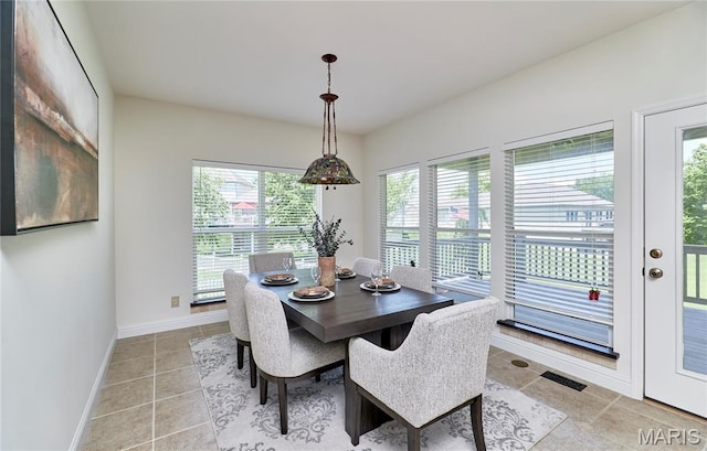 5 Tucker Manor Ct, Wentzville, MO 63385 - dining space with healthy amount of natural light and light tile patterned floors