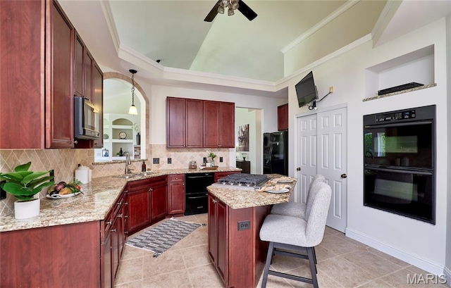 5 Tucker Manor Ct, Wentzville, MO 63385 - kitchen with black appliances, reddish brown cabinets, a kitchen breakfast bar, backsplash, and ceiling fan