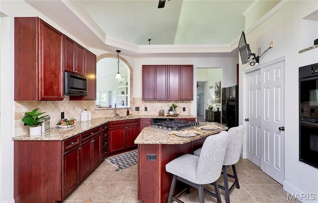 5 Tucker Manor Ct, Wentzville, MO 63385 - kitchen featuring dark brown cabinets, black appliances, a kitchen bar, backsplash, and crown molding