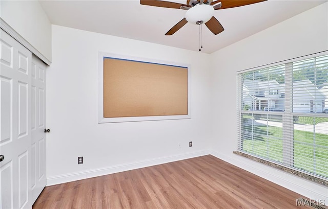 5 Tucker Manor Ct, Wentzville, MO 63385 - unfurnished bedroom featuring light wood-type flooring, a closet, and a ceiling fan