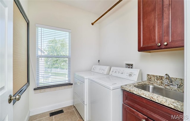 5 Tucker Manor Ct, Wentzville, MO 63385 - laundry room featuring separate washer and dryer, cabinet space, plenty of natural light, and light tile patterned flooring