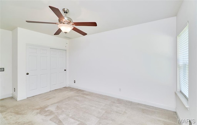 5 Tucker Manor Ct, Wentzville, MO 63385 - unfurnished bedroom with light carpet, multiple windows, and a closet