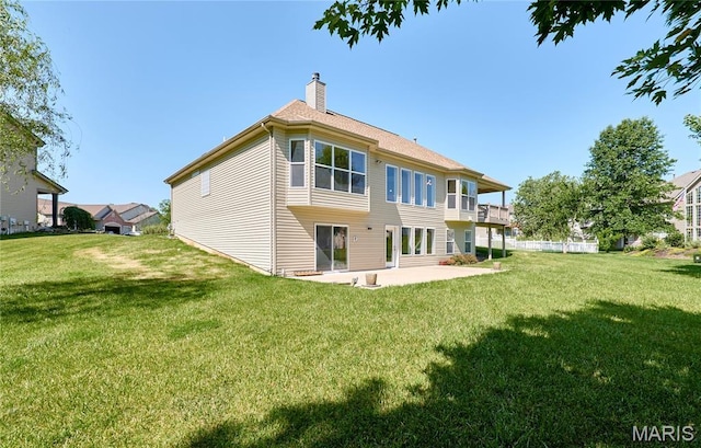 5 Tucker Manor Ct, Wentzville, MO 63385 - back of house featuring a patio, a chimney, and a yard