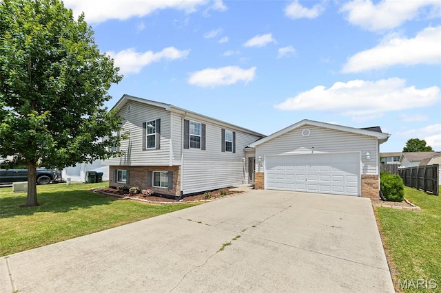 412 Audry Dr, Dupo, IL 62239 - view of front of home featuring brick siding, concrete driveway, and an attached garage