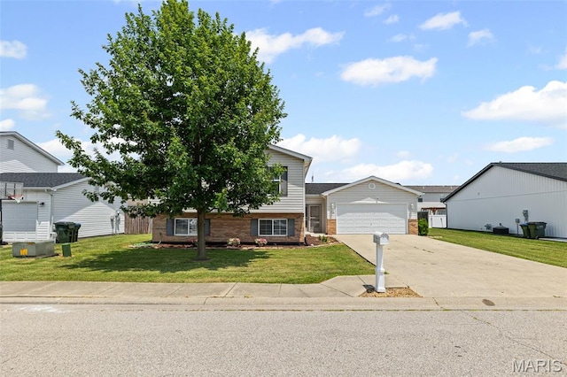 412 Audry Dr, Dupo, IL 62239 - view of front of house with driveway, a front yard, brick siding, and an attached garage