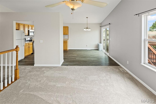 412 Audry Dr, Dupo, IL 62239 - unfurnished living room featuring dark carpet, a ceiling fan, a chandelier, dark wood-type flooring, and stairway