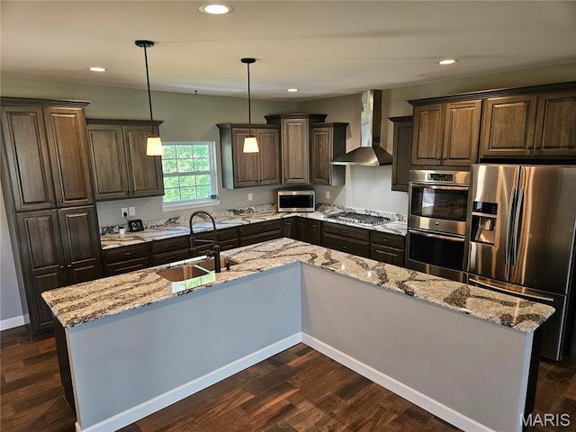 9339 Prairie Ridge Rd, Walsh, IL 62297 - kitchen featuring stainless steel appliances, wall chimney range hood, dark brown cabinets, dark wood-style floors, and recessed lighting