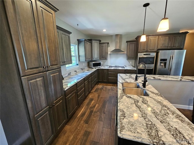9339 Prairie Ridge Rd, Walsh, IL 62297 - kitchen featuring appliances with stainless steel finishes, wall chimney exhaust hood, dark wood-type flooring, dark brown cabinetry, and recessed lighting