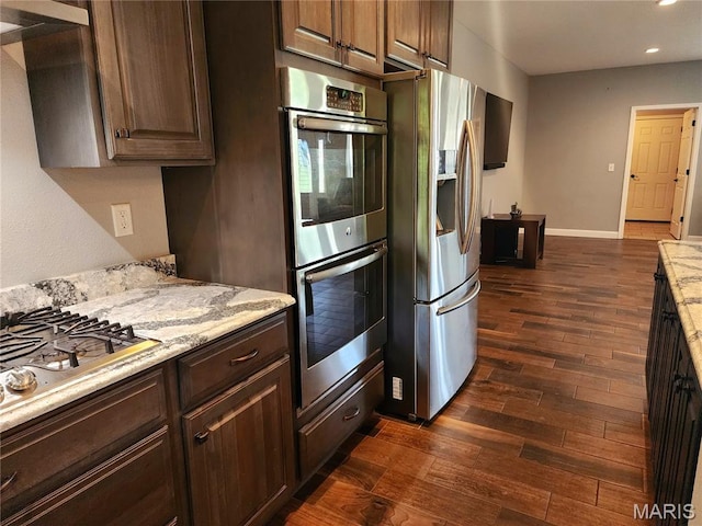 9339 Prairie Ridge Rd, Walsh, IL 62297 - kitchen with appliances with stainless steel finishes, dark wood-type flooring, recessed lighting, light stone countertops, and dark brown cabinets