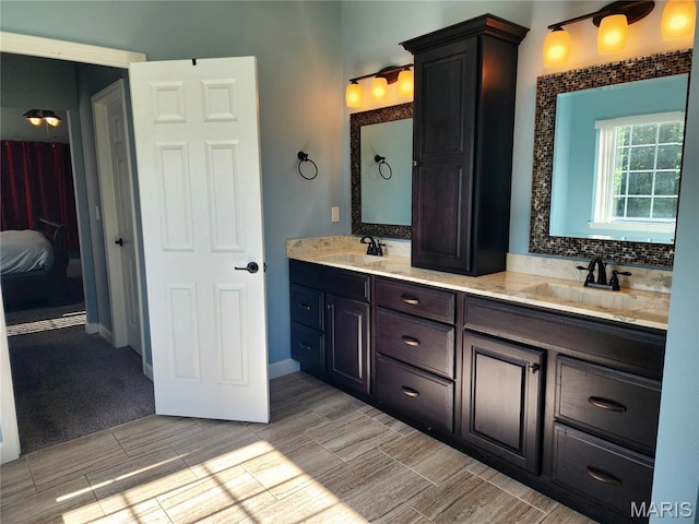 9339 Prairie Ridge Rd, Walsh, IL 62297 - full bathroom with double vanity, wood tiled floors, and ensuite bathroom