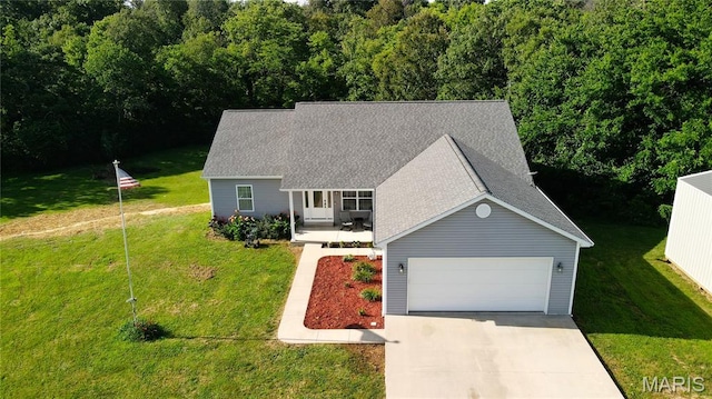9339 Prairie Ridge Rd, Walsh, IL 62297 - view of front of property featuring a shingled roof, a front lawn, concrete driveway, and a garage