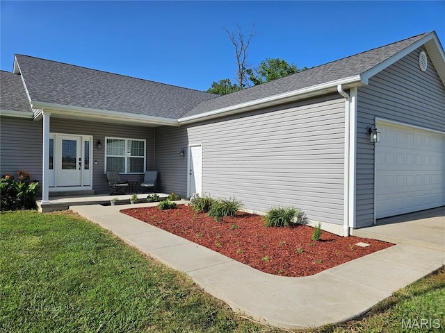 9339 Prairie Ridge Rd, Walsh, IL 62297 - view of front of house with a garage, a shingled roof, a porch, and driveway