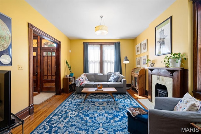 6505 Michigan Ave, Saint Louis, MO 63111 - living room featuring wood finished floors and baseboards