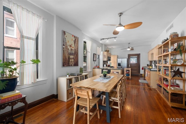 6505 Michigan Ave, Saint Louis, MO 63111 - dining space with ceiling fan, dark wood-type flooring, and track lighting