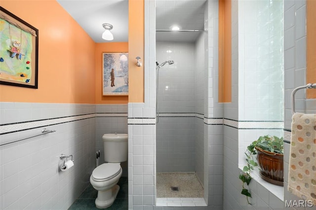 6505 Michigan Ave, Saint Louis, MO 63111 - full bath featuring tile walls, a stall shower, wainscoting, and tile patterned flooring
