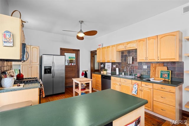 6505 Michigan Ave, Saint Louis, MO 63111 - kitchen with appliances with stainless steel finishes, light brown cabinets, tasteful backsplash, and dark wood finished floors