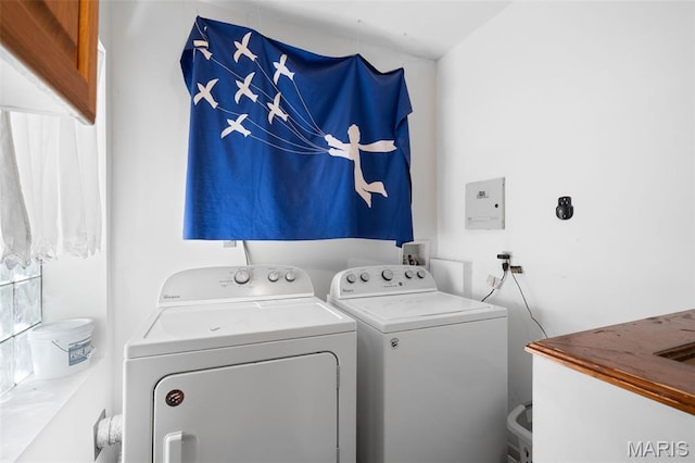 6505 Michigan Ave, Saint Louis, MO 63111 - washroom featuring washing machine and dryer and cabinet space