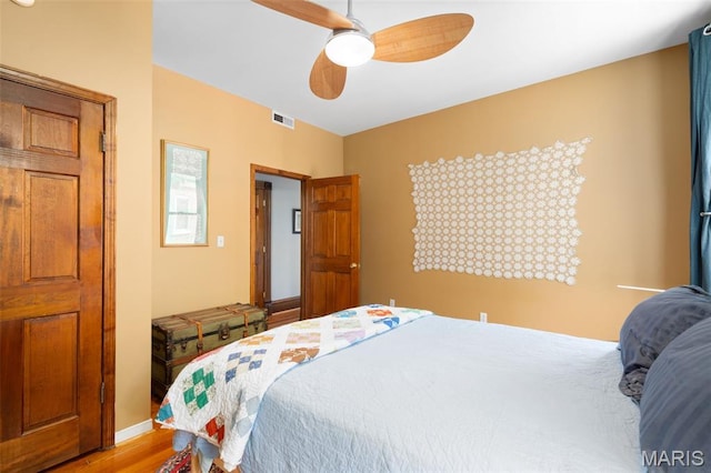 6505 Michigan Ave, Saint Louis, MO 63111 - bedroom featuring wood finished floors and a ceiling fan