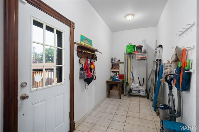 6505 Michigan Ave, Saint Louis, MO 63111 - doorway with light tile patterned floors and baseboards