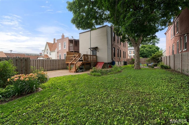 6505 Michigan Ave, Saint Louis, MO 63111 - back of property with a fenced backyard, a patio area, and a wooden deck