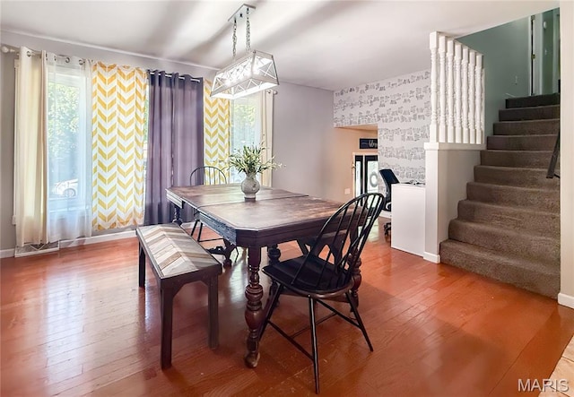 914 Ruby Dr, Farmington, MO 63640 - dining space with stairs, hardwood / wood-style flooring, and an accent wall