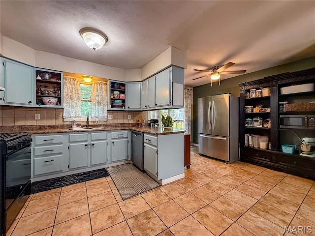 914 Ruby Dr, Farmington, MO 63640 - kitchen featuring appliances with stainless steel finishes, open shelves, ceiling fan, backsplash, and a textured ceiling
