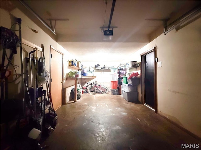 914 Ruby Dr, Farmington, MO 63640 - garage with a garage door opener and a workshop area