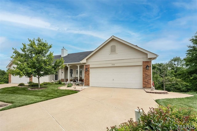 7202 Geneva Manor Ct, Oakville Township, MO 63129 - single story home with brick siding, a front lawn, concrete driveway, and an attached garage