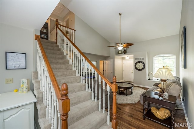 7202 Geneva Manor Ct, Oakville Township, MO 63129 - stairway featuring a ceiling fan, wood finished floors, and high vaulted ceiling