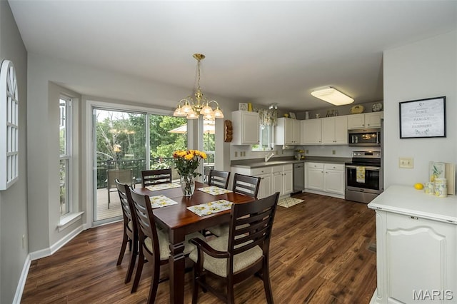7202 Geneva Manor Ct, Oakville Township, MO 63129 - dining room with dark wood-type flooring and a chandelier