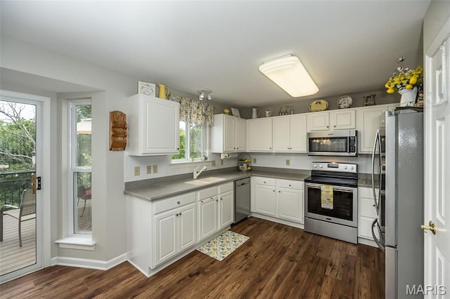 7202 Geneva Manor Ct, Oakville Township, MO 63129 - kitchen featuring stainless steel appliances, dark wood finished floors, and white cabinets