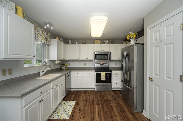 7202 Geneva Manor Ct, Oakville Township, MO 63129 - kitchen featuring stainless steel appliances, white cabinetry, and dark wood finished floors