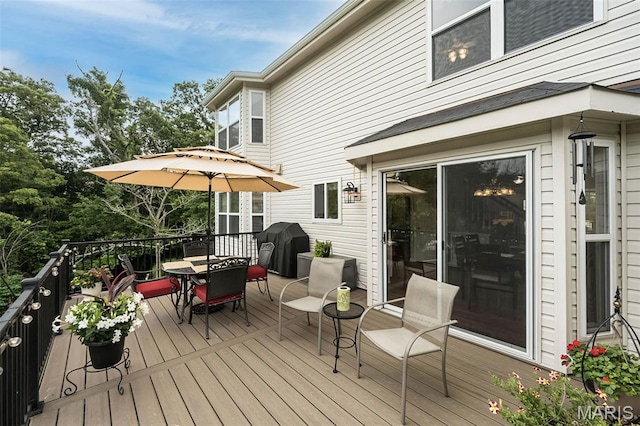 7202 Geneva Manor Ct, Oakville Township, MO 63129 - wooden deck with outdoor dining area and area for grilling