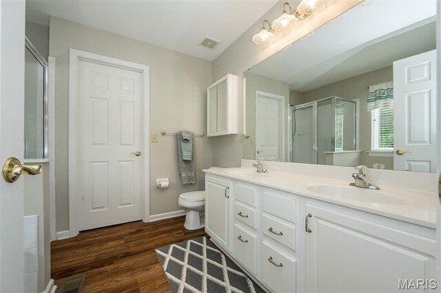 7202 Geneva Manor Ct, Oakville Township, MO 63129 - full bath with a shower stall, double vanity, and wood finished floors