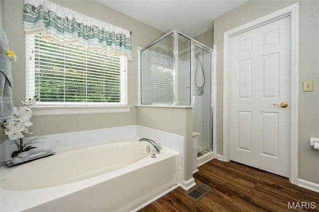 7202 Geneva Manor Ct, Oakville Township, MO 63129 - bathroom with a garden tub, a shower stall, and wood finished floors