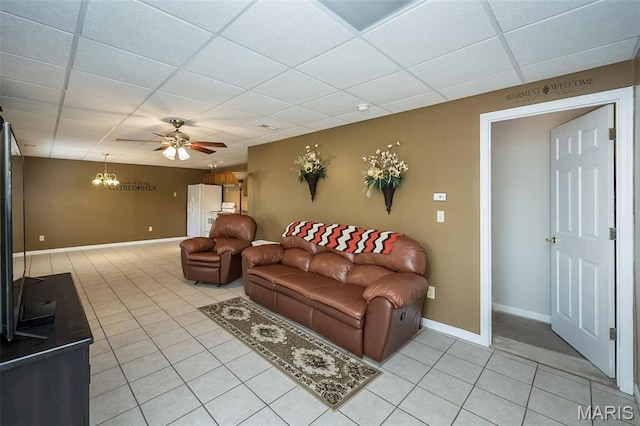 7202 Geneva Manor Ct, Oakville Township, MO 63129 - living area featuring light tile patterned floors, a paneled ceiling, and a ceiling fan