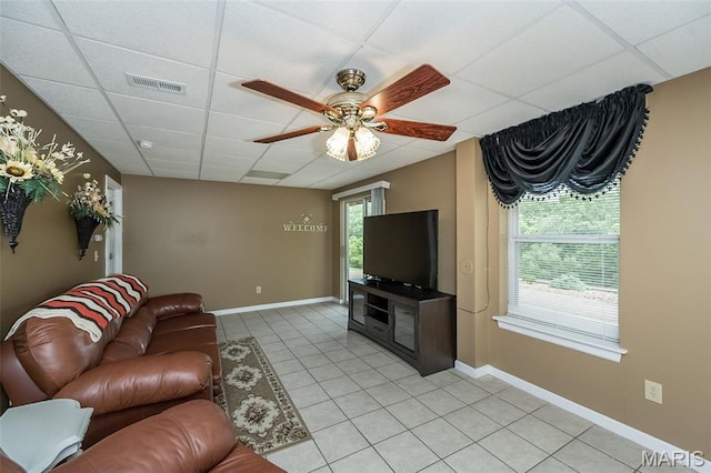 7202 Geneva Manor Ct, Oakville Township, MO 63129 - living room featuring a drop ceiling, light tile patterned floors, and a ceiling fan
