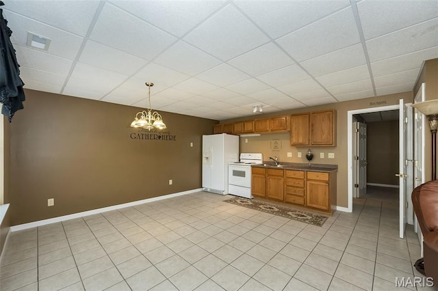 7202 Geneva Manor Ct, Oakville Township, MO 63129 - kitchen with white appliances, a paneled ceiling, brown cabinets, a chandelier, and hanging light fixtures