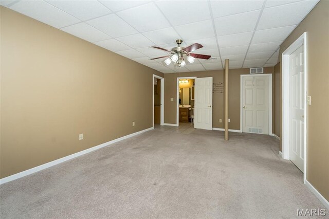 7202 Geneva Manor Ct, Oakville Township, MO 63129 - unfurnished bedroom featuring light colored carpet, a paneled ceiling, connected bathroom, and a ceiling fan