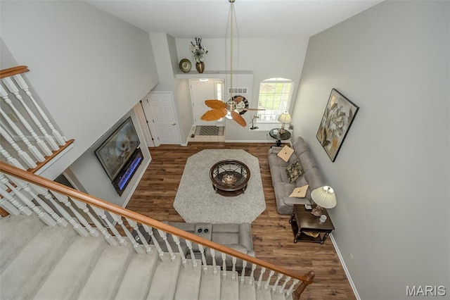 7202 Geneva Manor Ct, Oakville Township, MO 63129 - living room featuring stairway, wood finished floors, and a glass covered fireplace