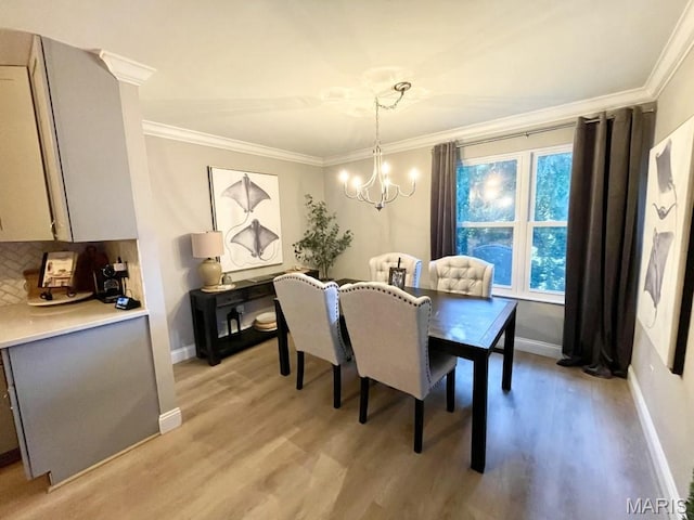 325 Fox Village Ct, Ballwin, MO 63021 - dining room featuring a chandelier, crown molding, and light wood-type flooring