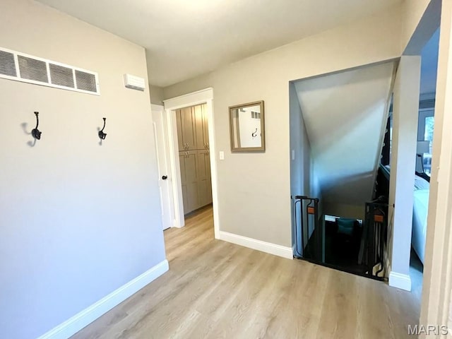 325 Fox Village Ct, Ballwin, MO 63021 - corridor featuring an upstairs landing and wood finished floors