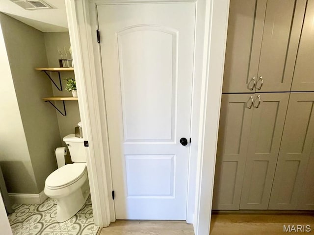 325 Fox Village Ct, Ballwin, MO 63021 - bathroom with toilet and baseboards
