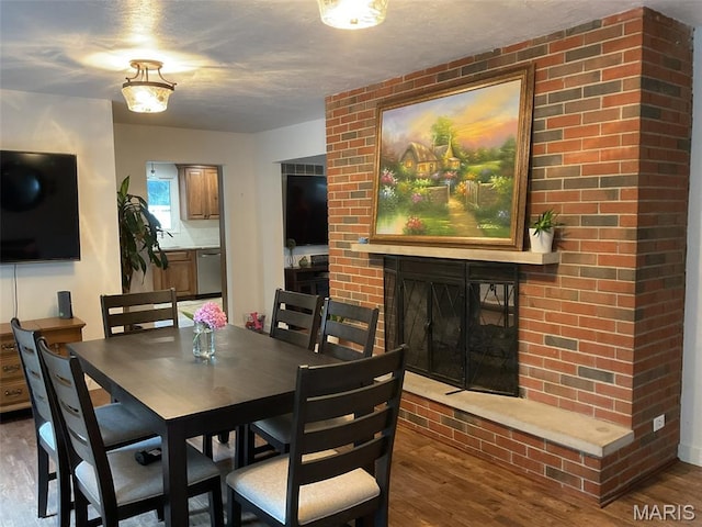 4303 State Route 160, Highland, IL 62249 - dining area featuring wood finished floors and a fireplace