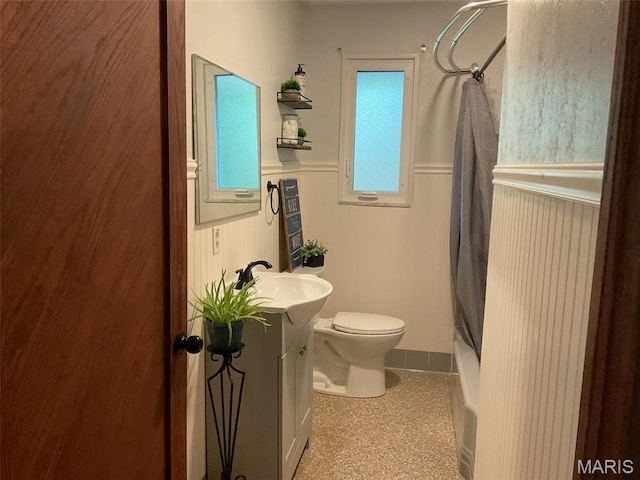 4303 State Route 160, Highland, IL 62249 - bathroom featuring a wainscoted wall, vanity, and shower / tub combo with curtain