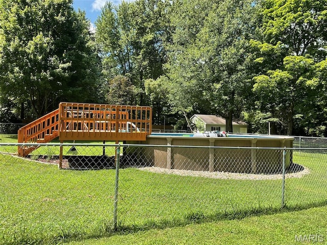 4303 State Route 160, Highland, IL 62249 - surrounding community featuring a deck, a swimming pool, and view of wooded area